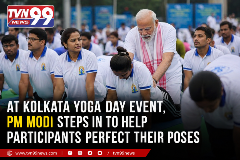 Prime Minister Narendra Modi assists participants with their yoga postures during the International Yoga Day event in Kolkata as thousands gather for the nationwide wellness celebration. TVN99 News graphic highlights the moment.