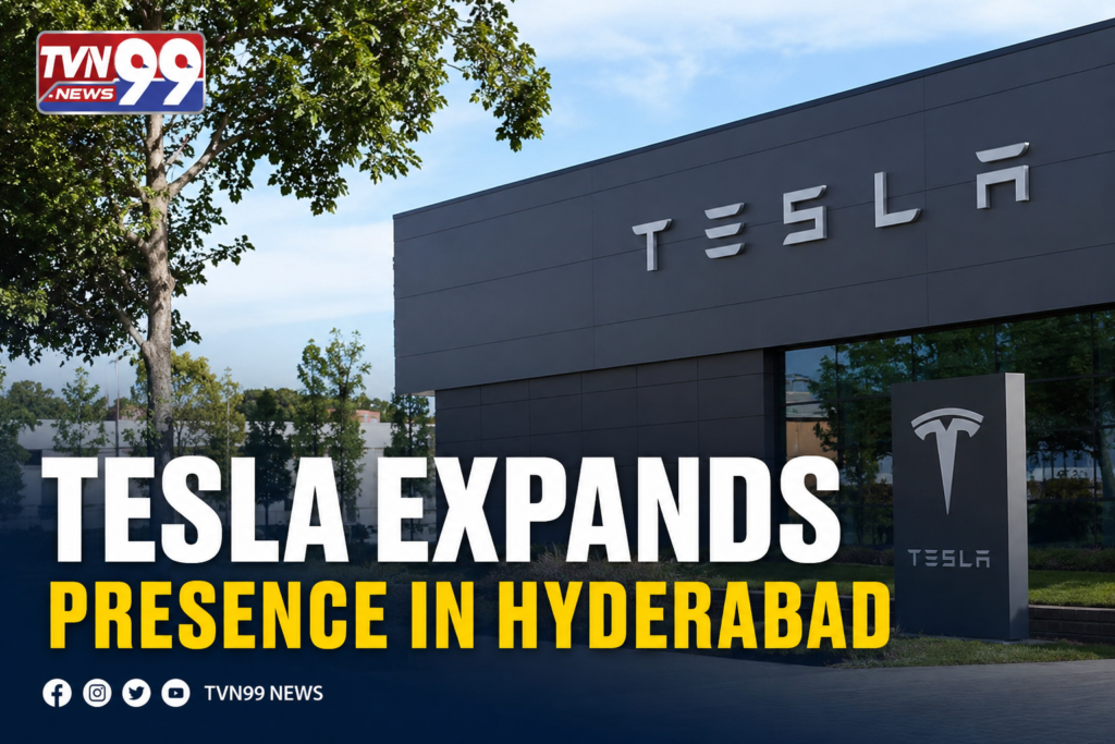 News graphic showing a Tesla facility with Tesla branding and the headline "Tesla Expands Presence in Hyderabad." The TVN99 News logo appears in the top-left corner, highlighting Tesla's growing operations and expansion efforts in Hyderabad, India.