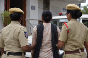 Representational image showing police officers escorting a woman during an investigation related to an alleged child abuse case in Ranga Reddy district.