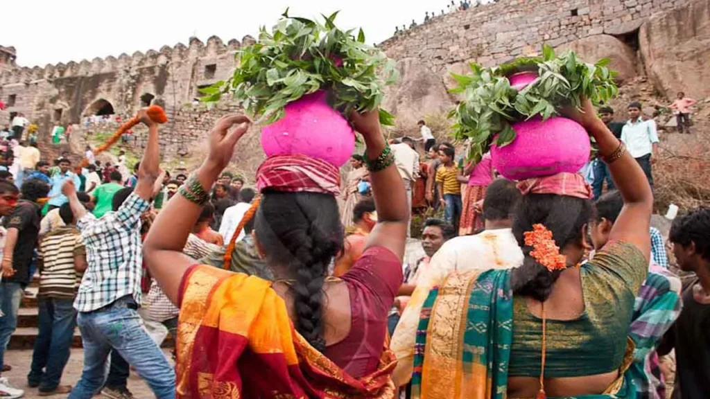Bonalu Festival 2026 preparations underway in Telangana with devotees carrying traditional Bonam offerings at Golconda Fort ahead of celebrations beginning on July 16.